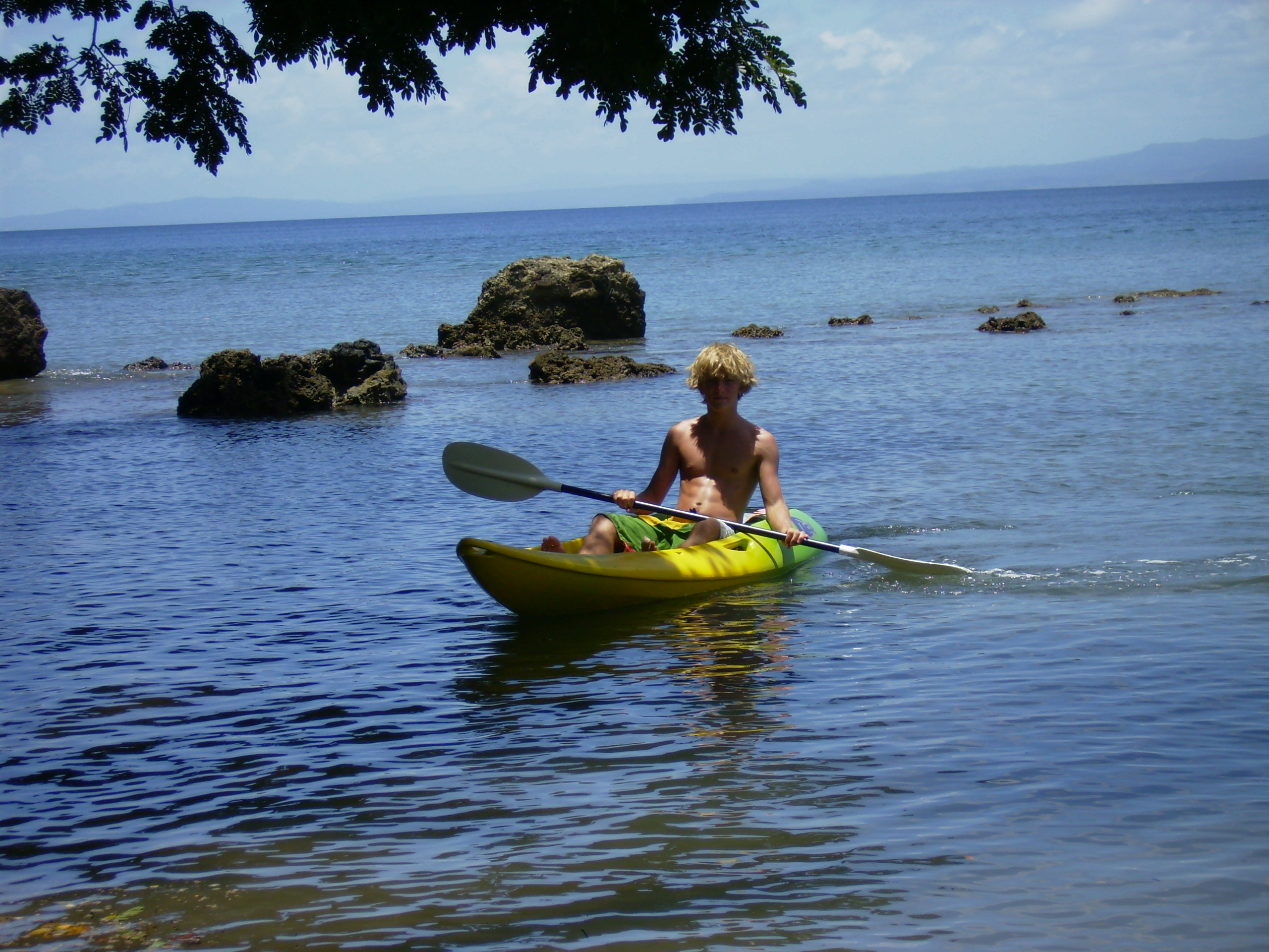 Tourist kayaking off Savusavu Harbor, Fiji