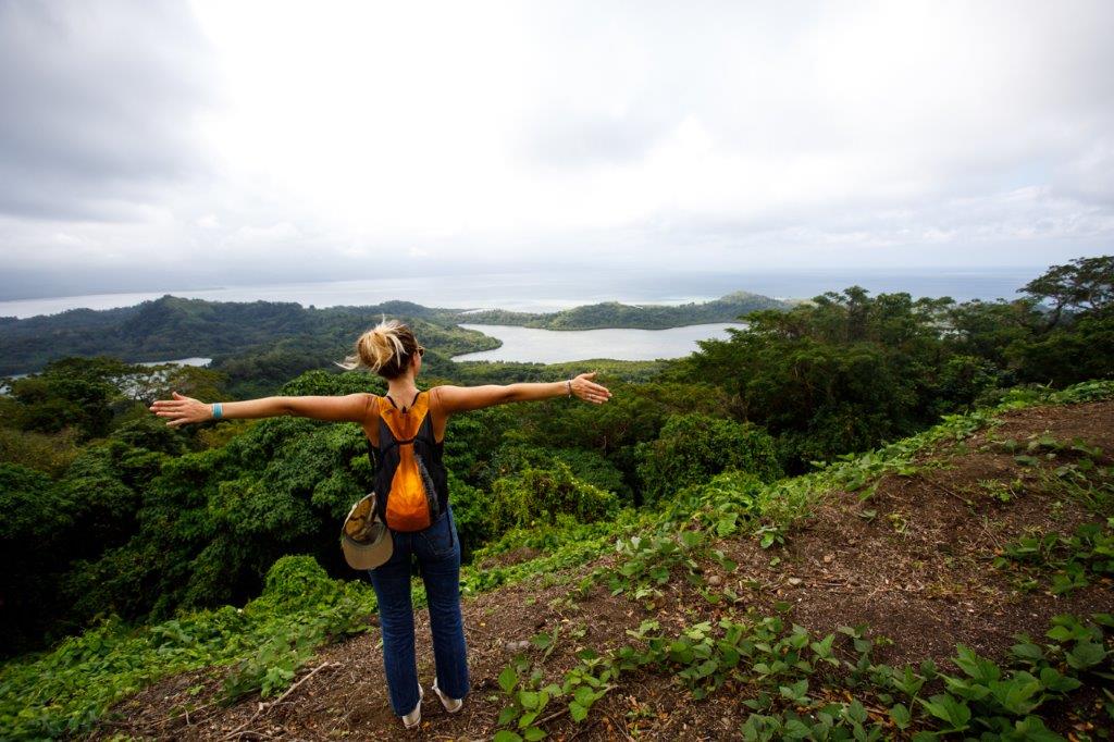A woman appreciates the view while hiking in Savusavu, Fiji.