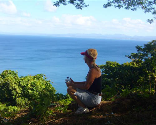 A woman reflects while hiking near Savusavu, Fiji.