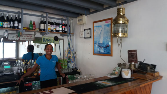 A woman behind the bar at the Savusavu Yacht Club.